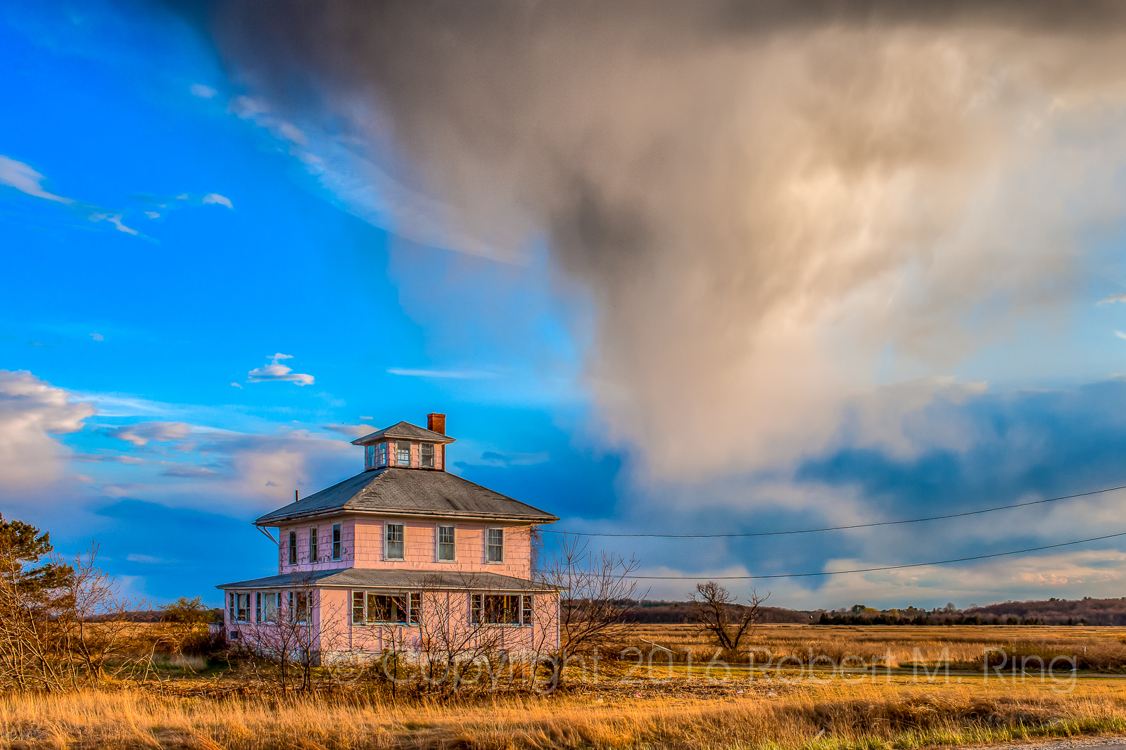 In April of 2012 I was heading home after photographing some storm clouds by the ocean. &nbsp;As I was driving by the pink house...